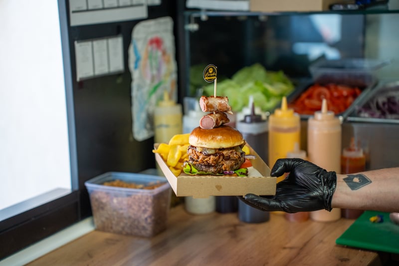 Loaded burger in takeaway box